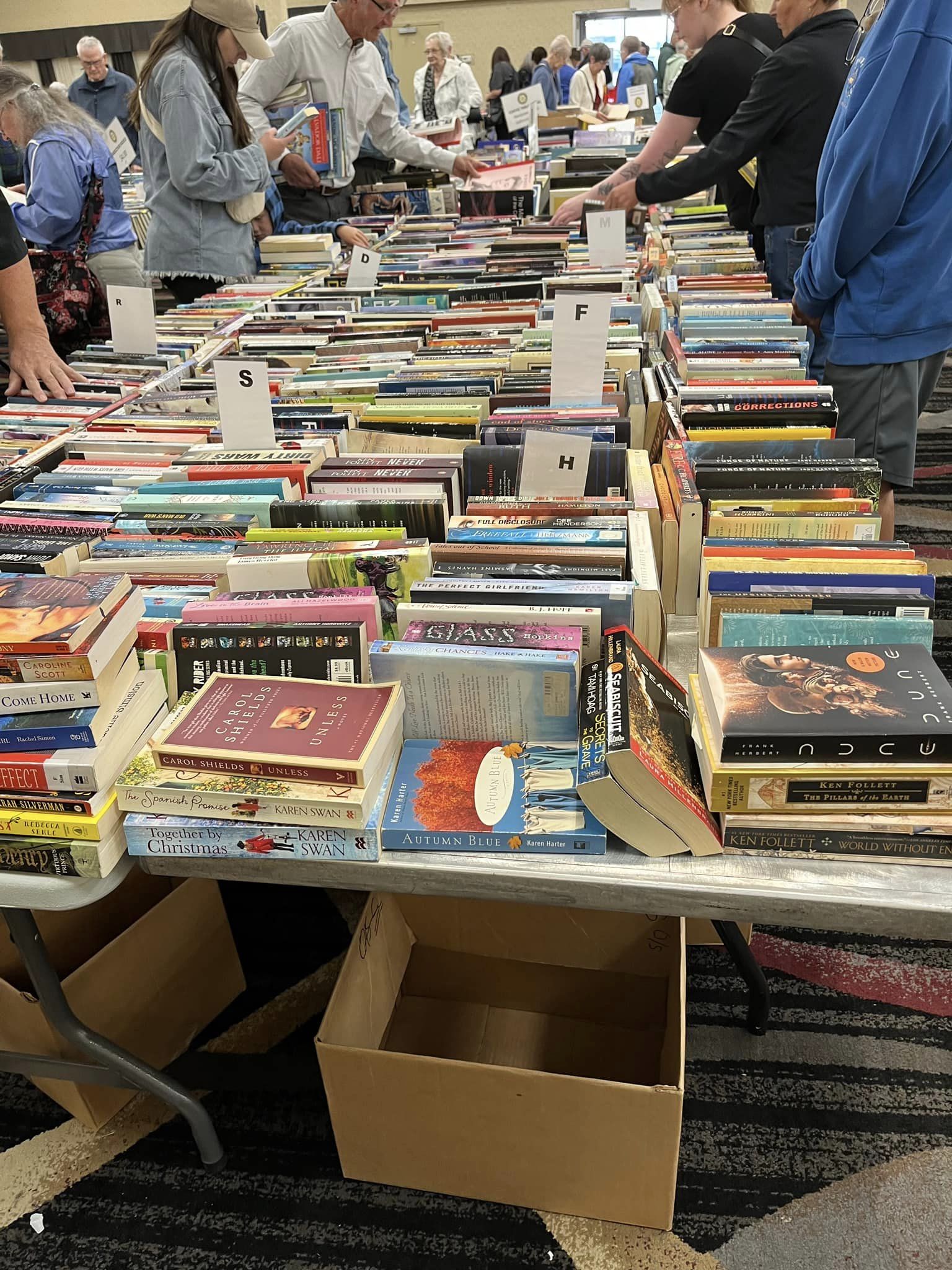 How much does it take to move 100,000 lbs of books? Ask the Rotary Club